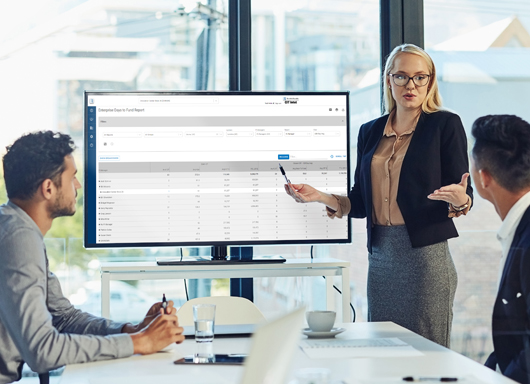 People reviewing CIT Intel screen on a monitor in a dealership conference room.