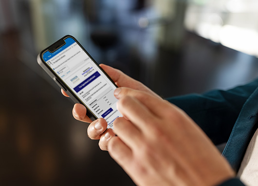 Person on phone using ConsumerReach Plus to email dealership 