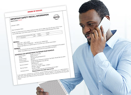 Customer on phone for recall notification.