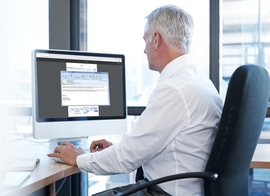 Dealership Controller at desk 