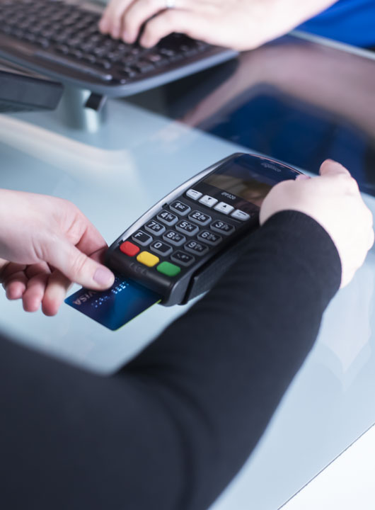 customer paying with credit card at payment terminal using ReyPAY