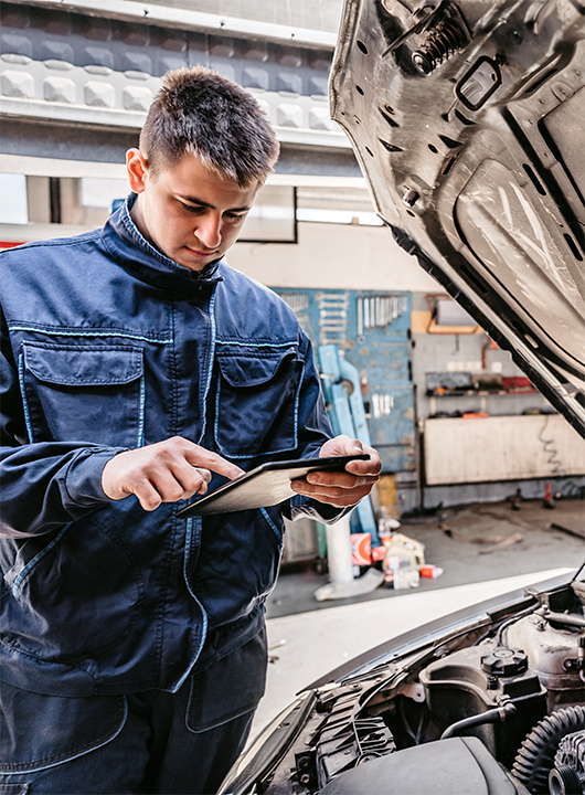 Service Technician looking at Retail Market on tablet