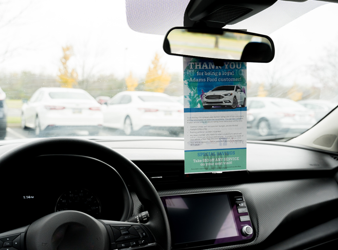 PromoTAG custom dispatch solutions hanging in the customer's vehicle 