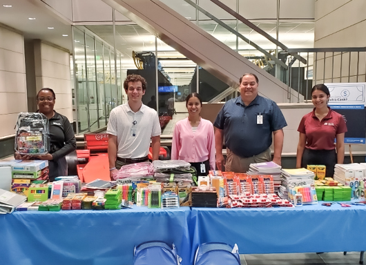 Associates collecting school supplies for donation drive