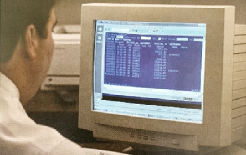 Man looking on older computer monitor with POWER screen