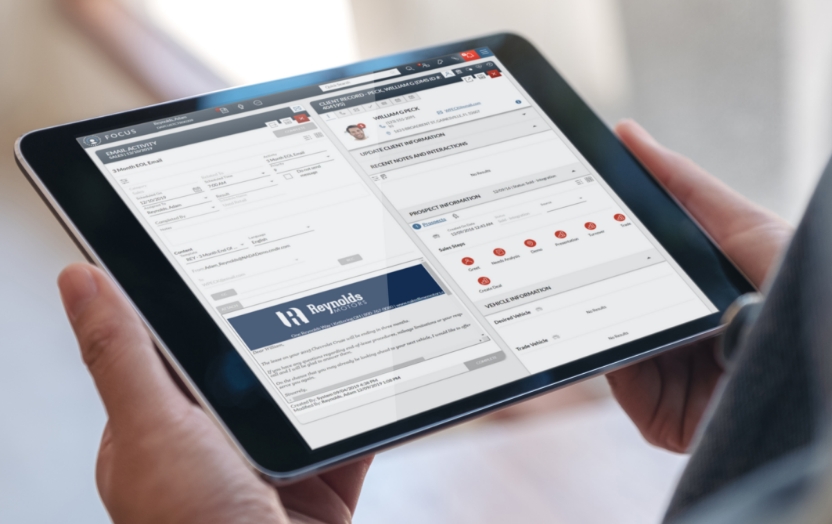 Person holding tablet with FOCUS screen