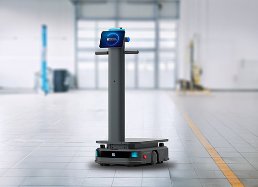 Relo, the parts running robot, in the middle of a service bay